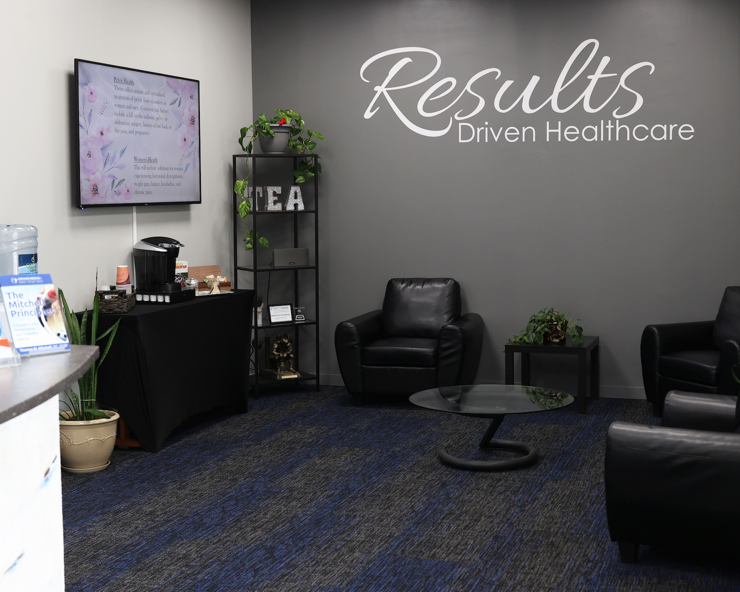 Lounge at CIHW with Results Driven Healthcare on the wall
